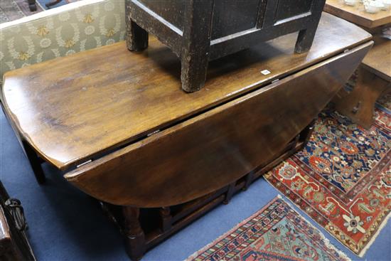 A reproduction oak circular gateleg table, W.168cm